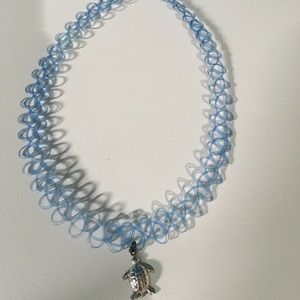 Blue tattoo choker with turtle pendant